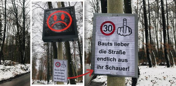Protest mit Stinkefinger-Schild gegen 30er-Zone